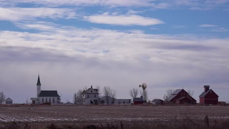 Establishing-shot-of-a-classic-beautiful-farmhouse-farm-and-barns-in-rural-midwest-America-York-Nebraska