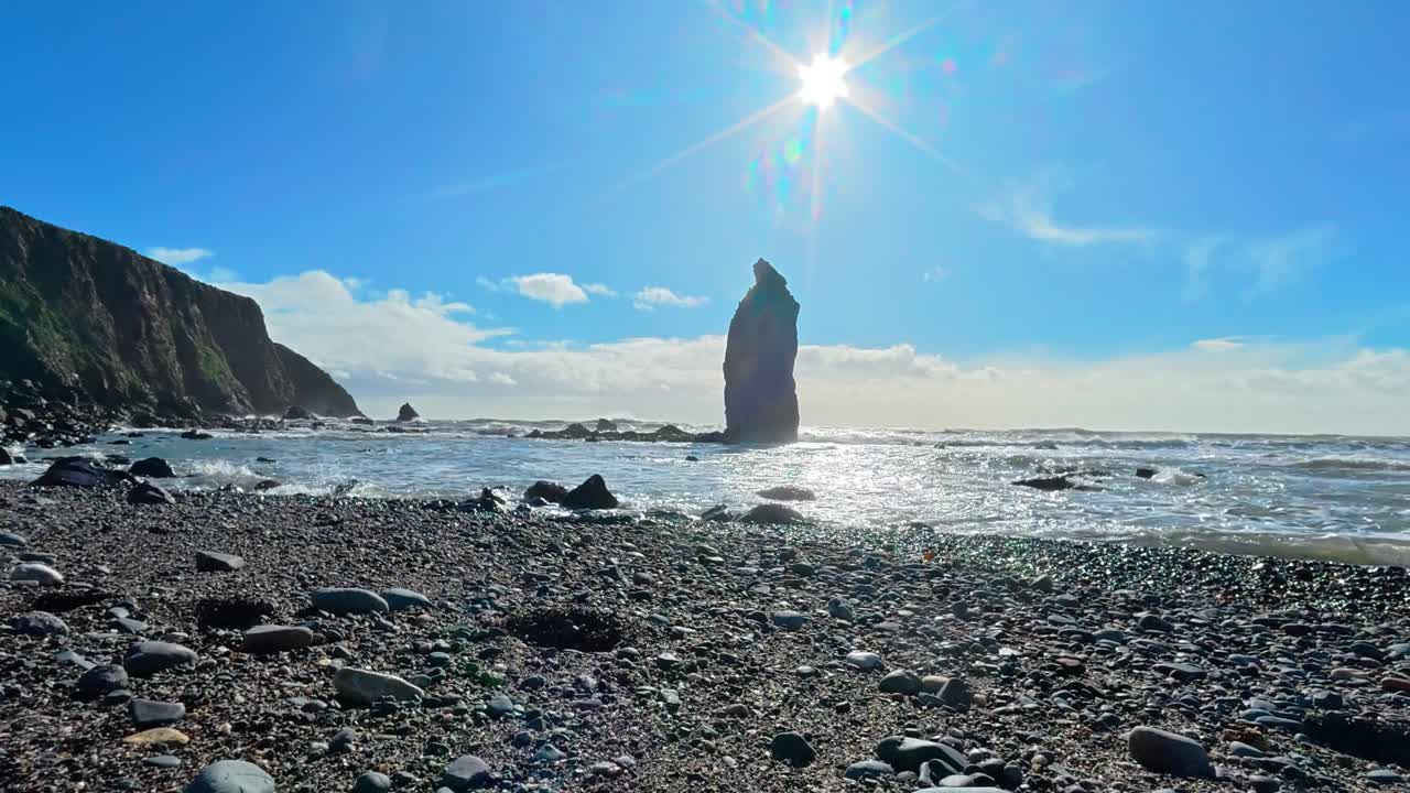 Timelapse Irish Beach dramatic sea stack Copper Coast Waterford spring morning and sunlight