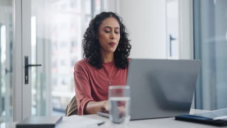 woman working on laptop in office
