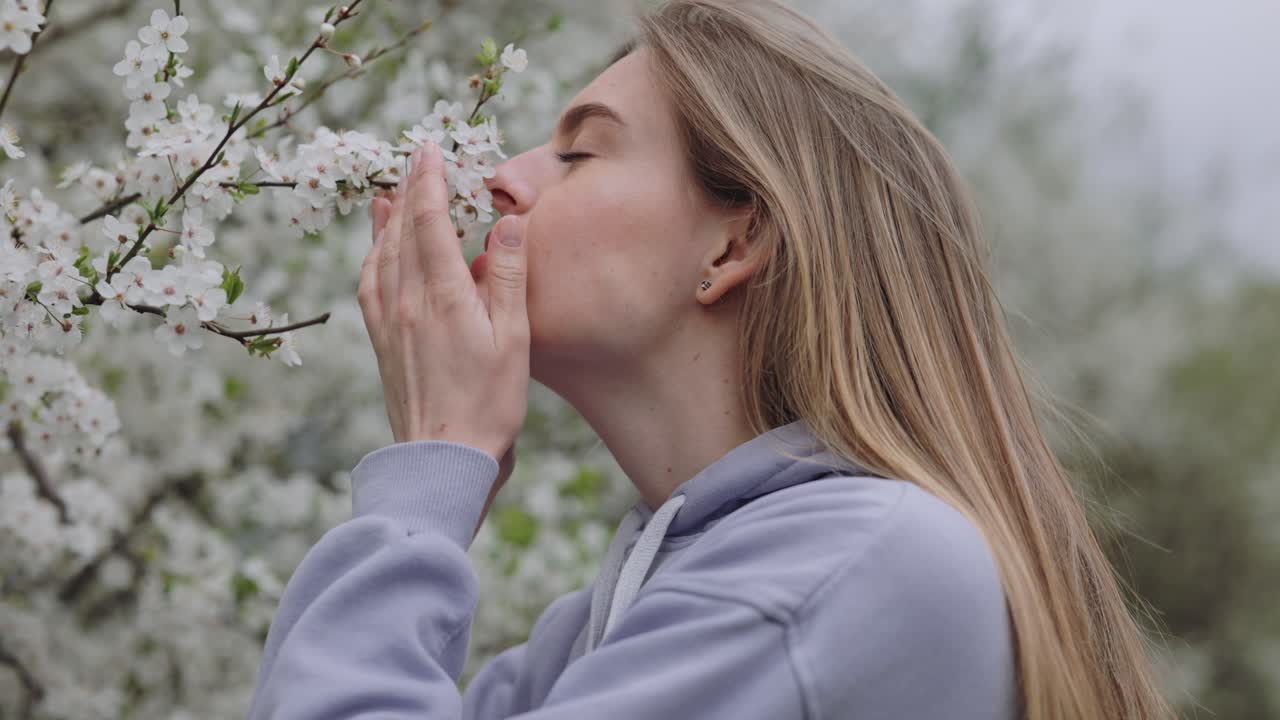 Woman enjoying spring flowers