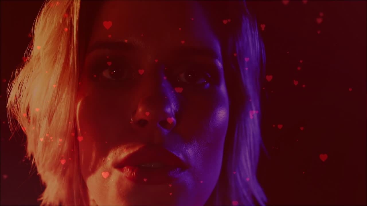 teenage girl gazing in studio, showcasing marketing concept with red blue heart overlays