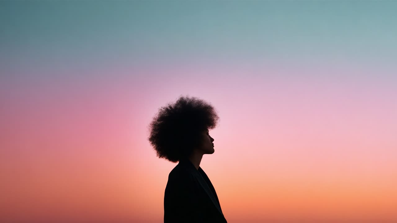 A serene silhouette of an individual with a beautiful afro against a mesmerizing gradient sky during dusk, capturing the essence of tranquility and reflection in nature