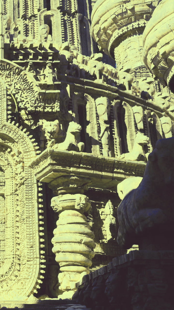 Carved stone structure showing intricate designs and tall domes at location