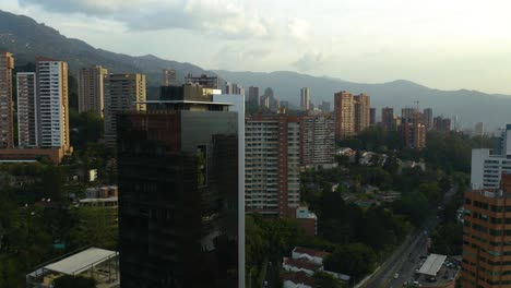 drone rises to reveal el poblado, medellin, colombia