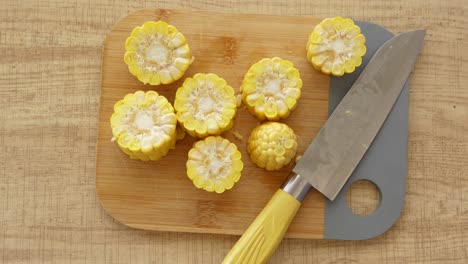 corn cut into pieces on a cutting board