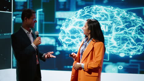Presenter and guest chatting during AI summit discussion panel