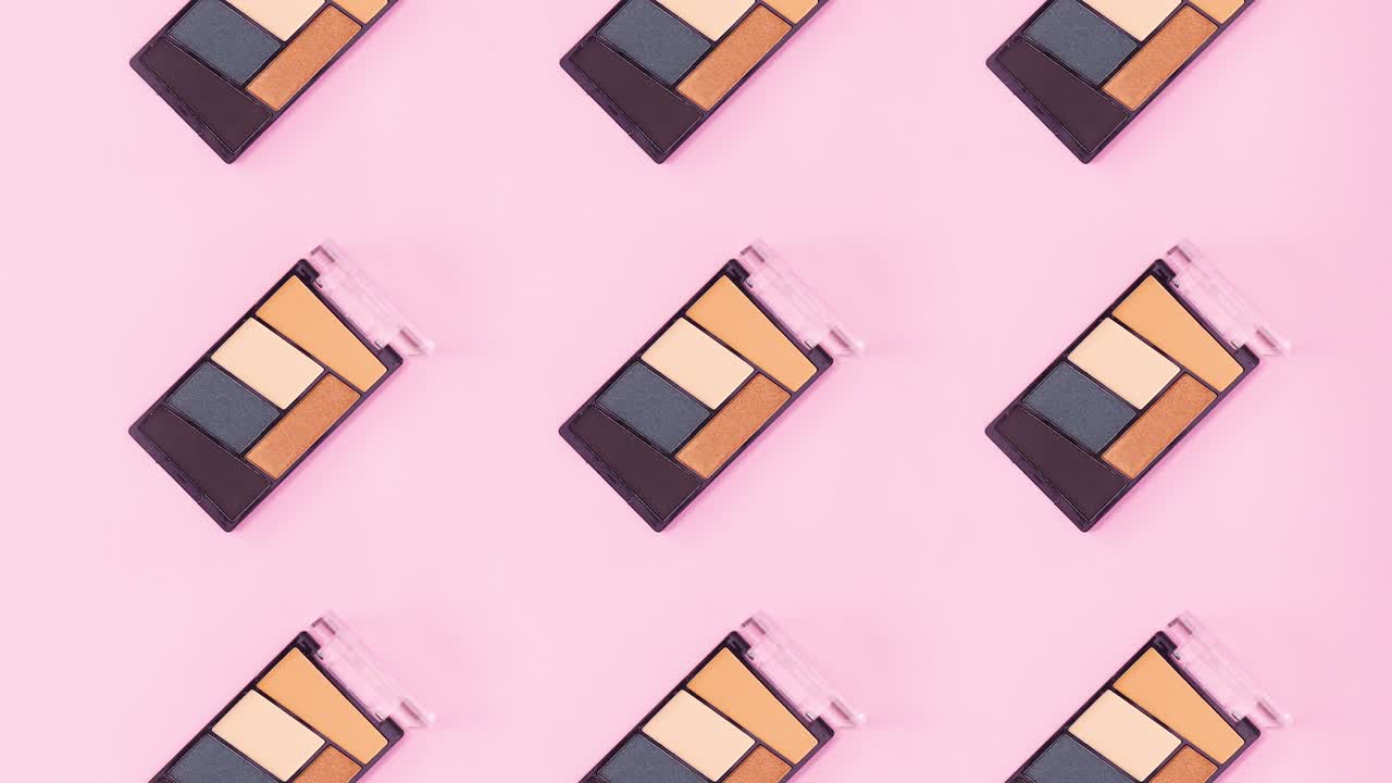 Motivo composto da ombretti con vari colori che ruotano su un tema rosa brillante. Stop motion.