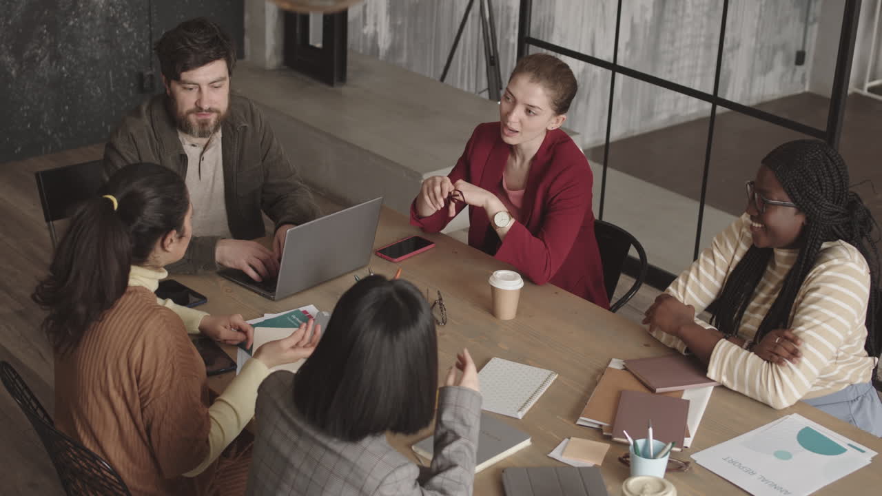 Diverse Colleagues Having Conference at Table