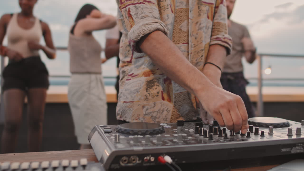 Close Up of DJ Playing at Party