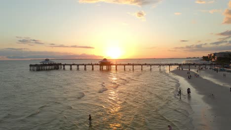 aerial view of people on vacation in beautiful fort myers beach, pier