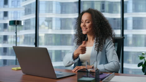happy woman gesturing yes alone at office closeup. manager satisfied work result