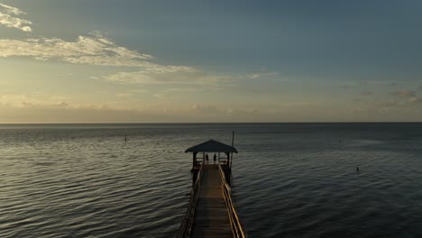 Aerial-view-of-docks,-boats,-slips-and-Mobile-Bay-in-Alabama-as-the-sun-sets