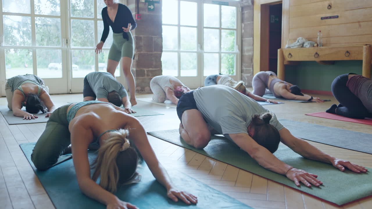 Yoga class practicing stretching poses