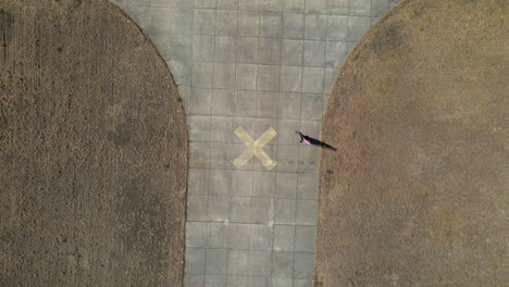 Aerial-Birds-Eye-view-of-land-sailing-buggy-circling-an-X-on-a-disused-airfield