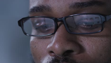 cropped shot of afican-american entrepreneur in glasses work on computer