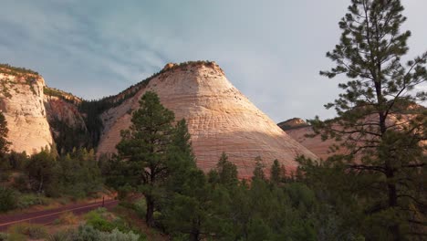 Static wide shot of Checkerboard Mesa rock formation in Zion National Park