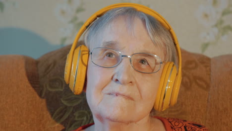 elderly woman listening to music in headphones