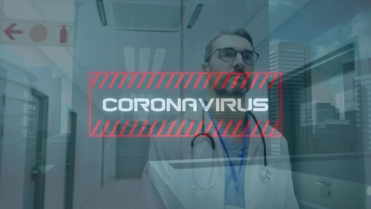 Animation of coronavirus text banner over caucasian male doctor walking in the hospital corridor