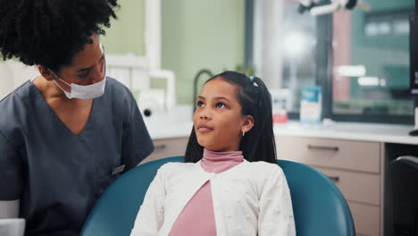dentist examining a young patient