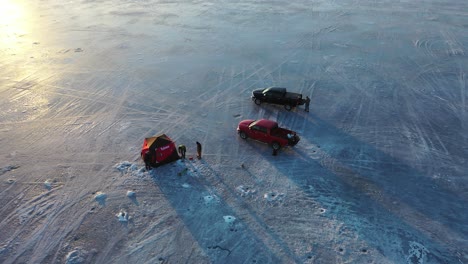 ice fishing on a frozen lake