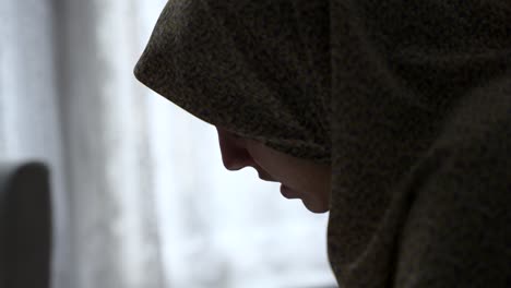 muslim woman reading quran, close up on woman's face