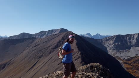 Hiker-looking-walking-on-peak-close-up-slow-motion-pan-Kananaskis-Alberta-Canada