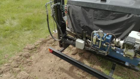 soil examination of agronomy. geotechnical investigation. collecting black soil on the field for examination and analysis. special equipment for pickup