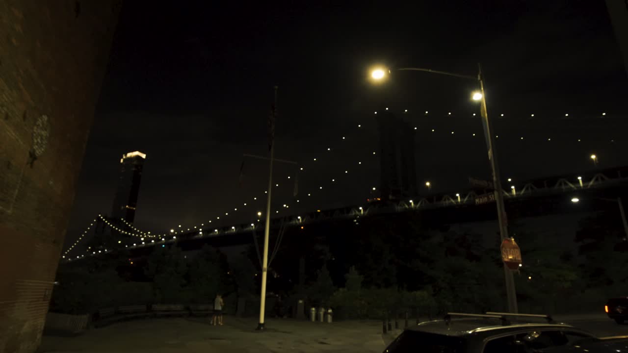 Gimbal reveal of the Brooklyn Bridge against Dark Night - Street View New York