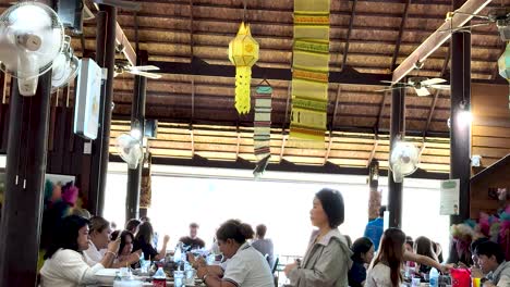 people enjoying meals in a bustling restaurant