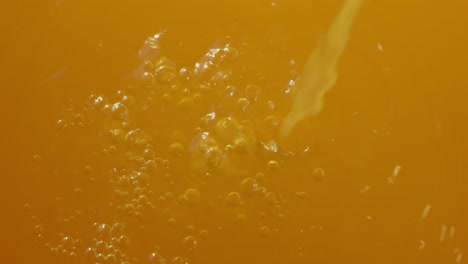 pouring orange juice