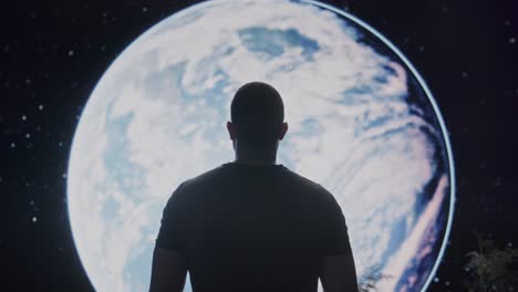 man looking at earth from space