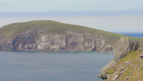 panoramic view overlooking dingle peninsula and sea, ireland, on sunny day