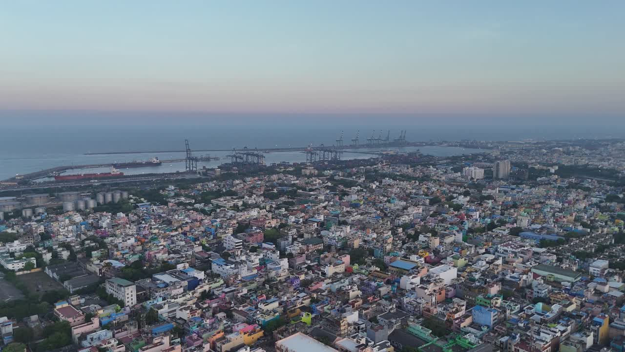 Footage of twilight over North Chennai, where urban life meets port activity