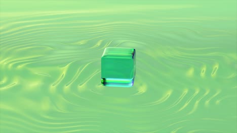 green iridescent cube on liquid surface