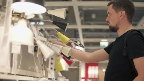 man shopping for lamps in a lighting store