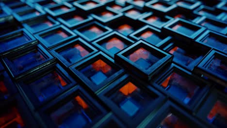 abstract background from metal cubes with random offset effect. the glass inside the cubes reflects light. seamless loop 3d render