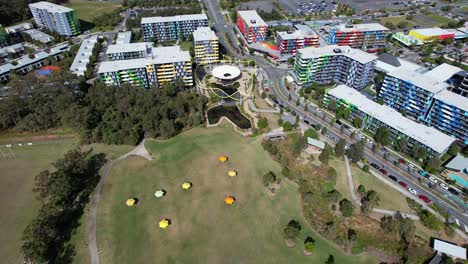 aerial view of village heart park and smith collective apartment buildings in southport, queensland, australia