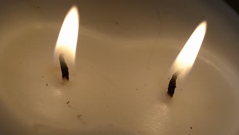 lighting a candle with a match