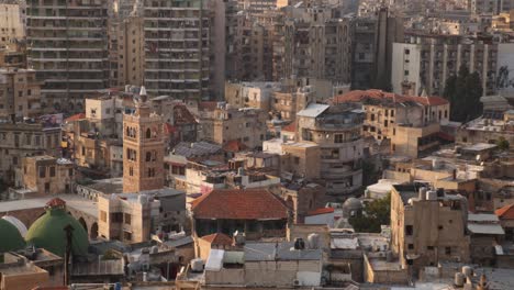 aerial panning view of old arab town with mosque and minaret in tripoli, northern lebanon