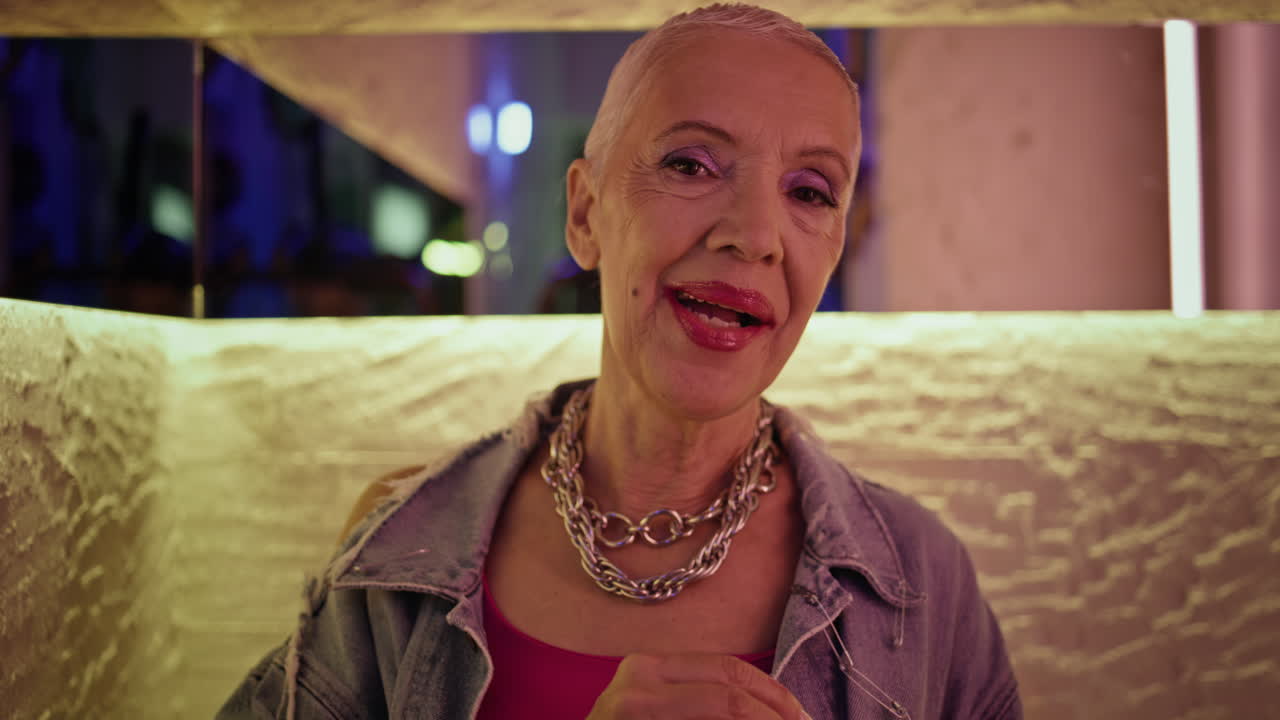 Elderly woman talking date in bar closeup. Happy senior relax enjoying evening
