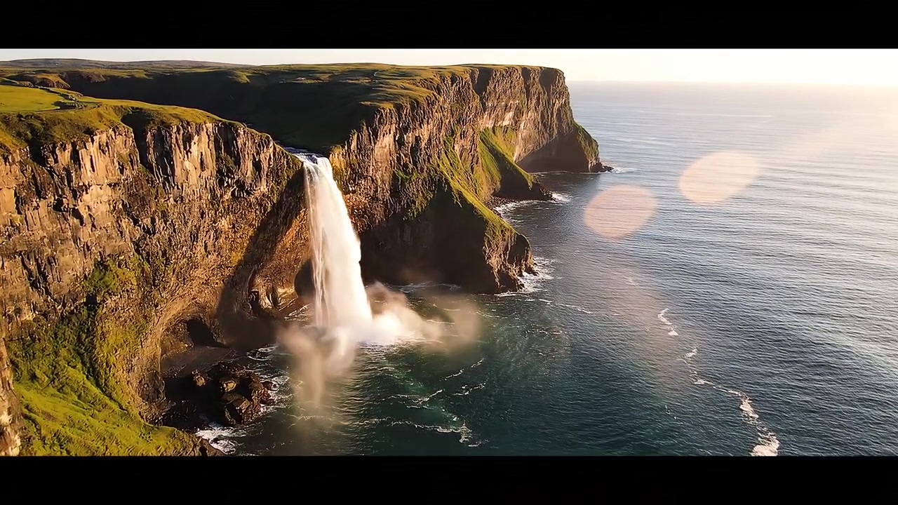 Majestic Coastal Waterfall Cascading Over High Cliffs Into the Ocean