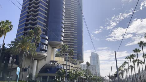 architecture of the city downtown san diego with tram tracks, skyscrapers and palm trees, near the convention centre