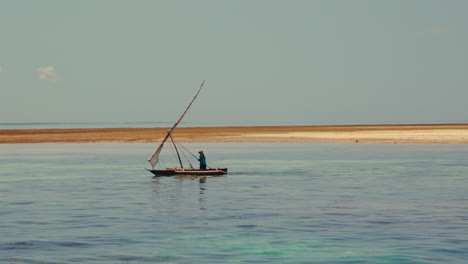 fisherman in a dhow boat