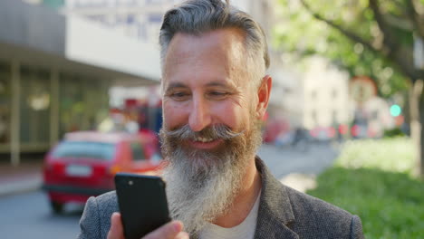 Closeup-of-mature-man-using-phone-to-search-fun