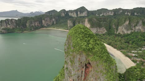 bat cave and beach scenery amidst thailand's stunning limestone landscape in railay