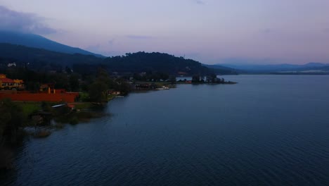 Lake-Tzirahuen-in-Michoacán,-Mexico,-captivates-with-its-natural-beauty:-crystal-clear-waters-surrounded-by-mountains,-a-serene-and-enchanting-paradise