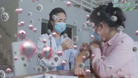 Animation-of-covid-19-cells-floating-over-woman-in-face-mask-receiving-vaccination