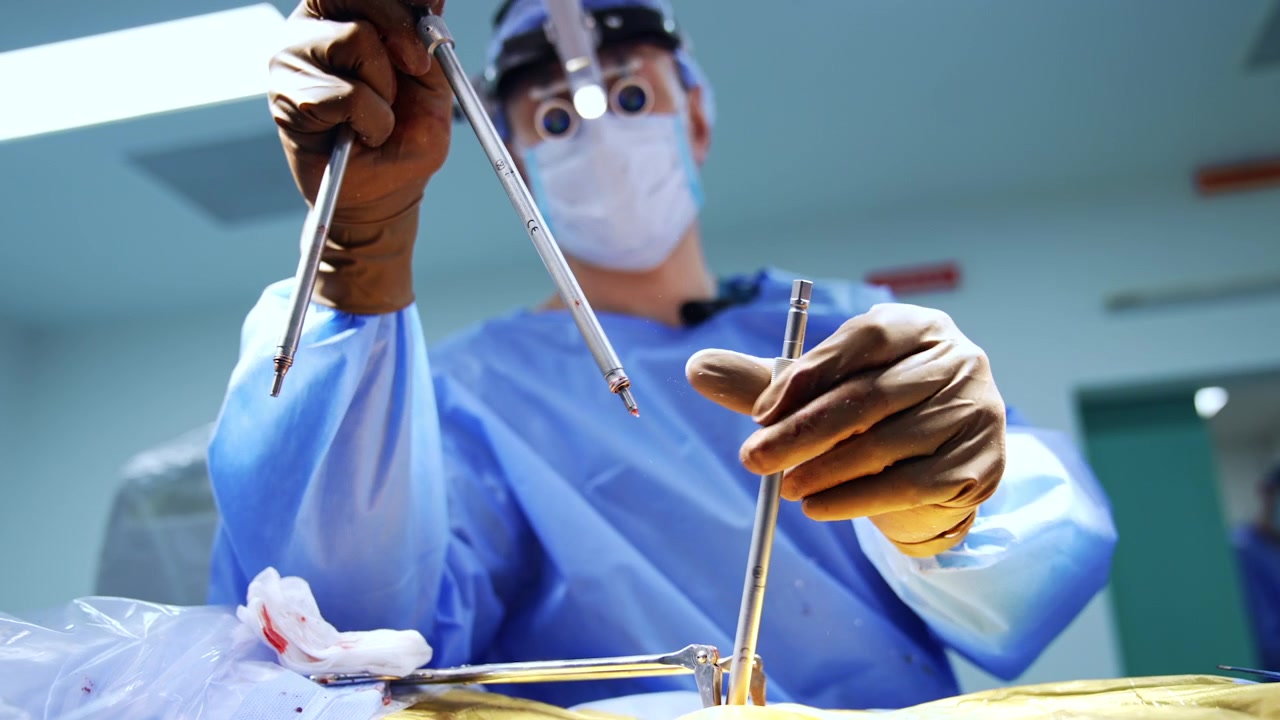 Close-up of Doctor's Hands Preparing Medical Tools for Surgery