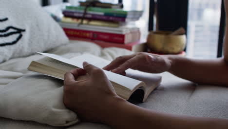 woman reading a book indoors