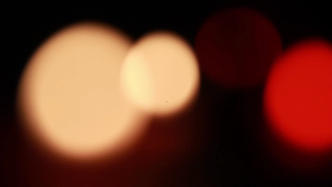 Dynamic Bokeh Light Circles Shimmering on a Dark Background